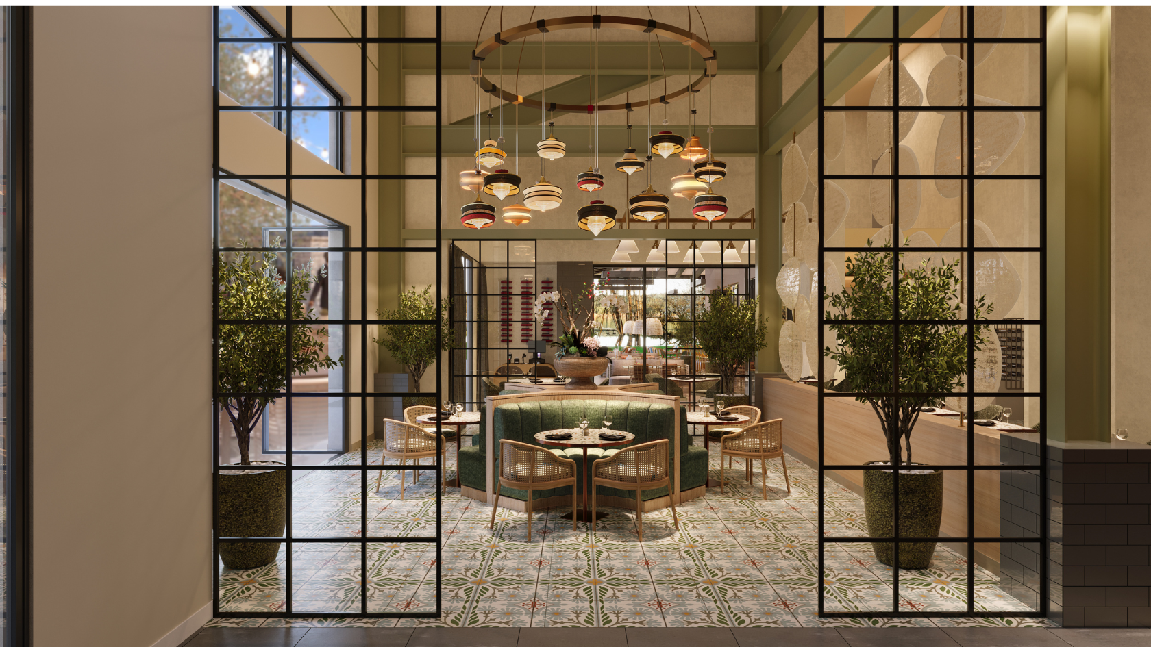 A stylish restaurant interior with a central green banquette, glass-paned walls, warm lighting, potted trees, and multiple tables set for dining.